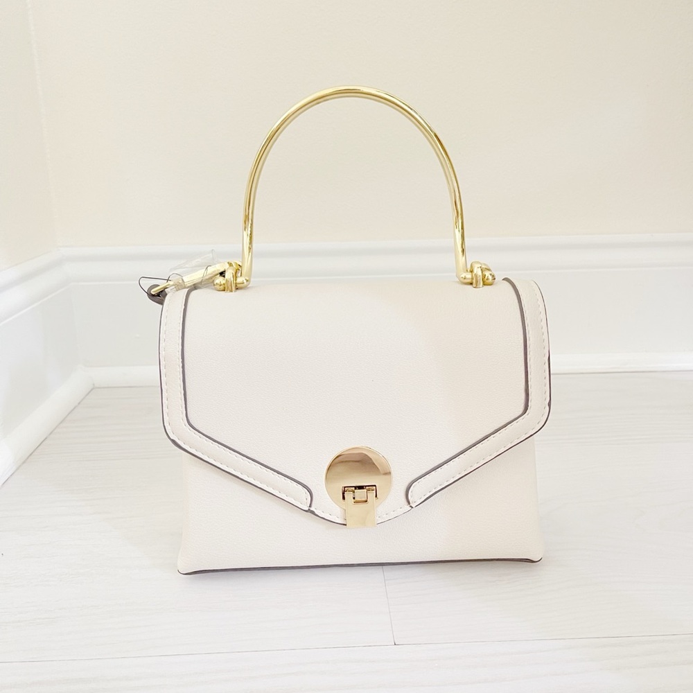 Elegant Cream Handbag with Gold Accents